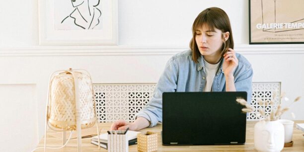 Girl working on year-end messaging on her laptop