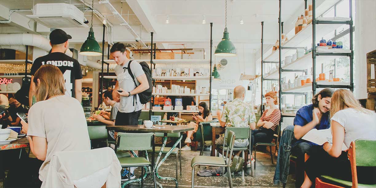 People working and socializing at local coffee shop